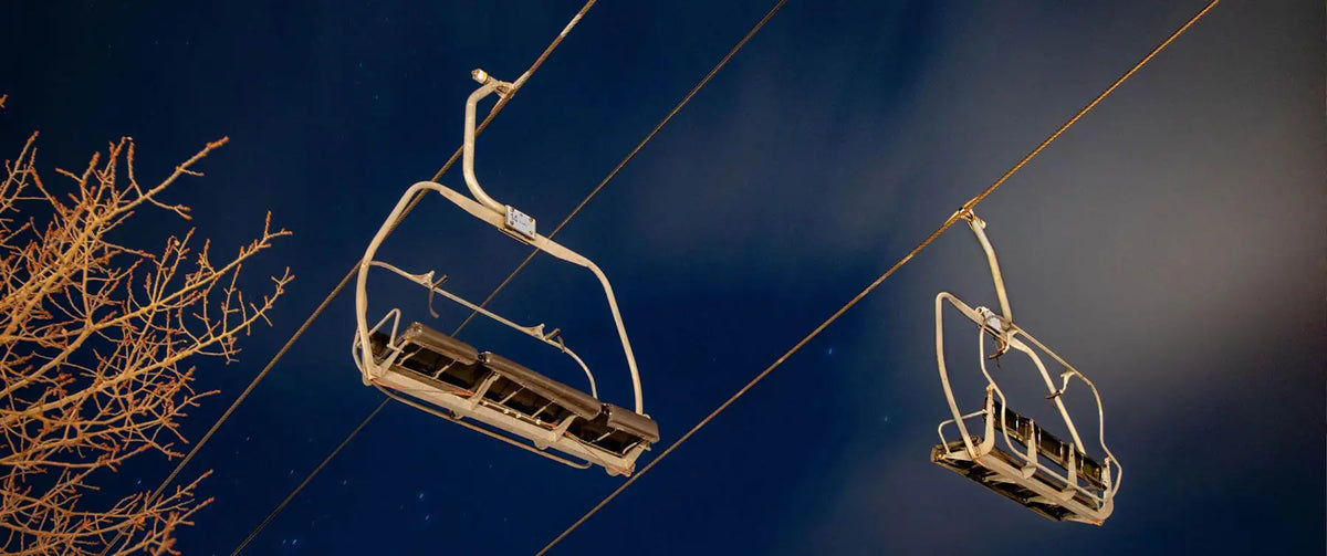 Aspen ski lift beneath a starry night sky
