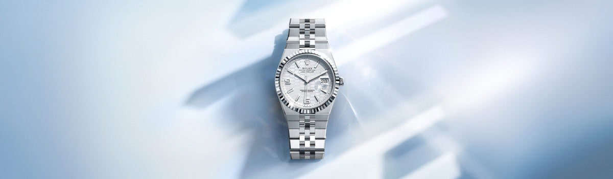 Rolex Land-Dweller in Oystersteel with a white dial and fluted bezel